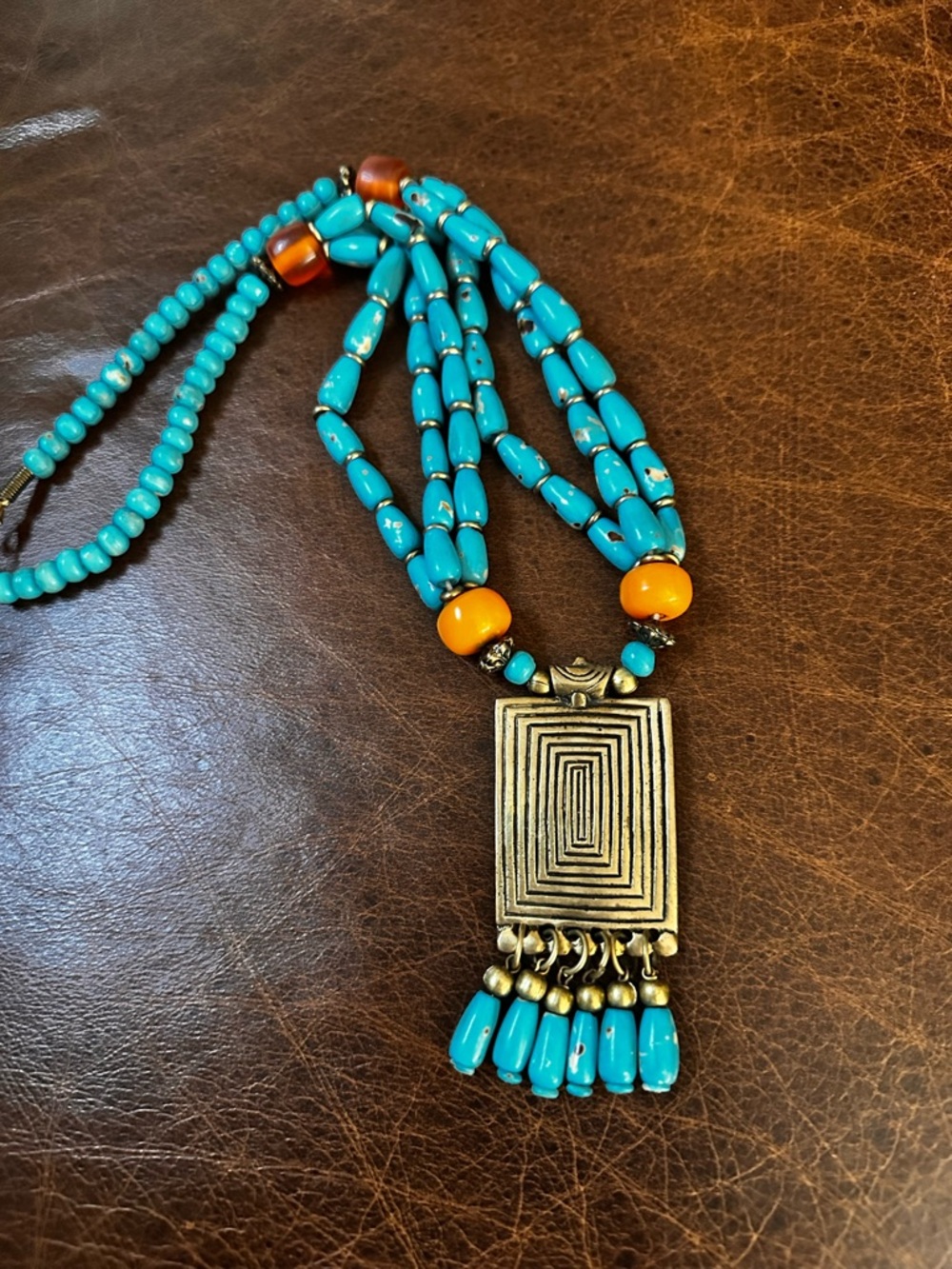 Artisan Turquoise colored Beaded Necklace with Brass Geometric Pendant